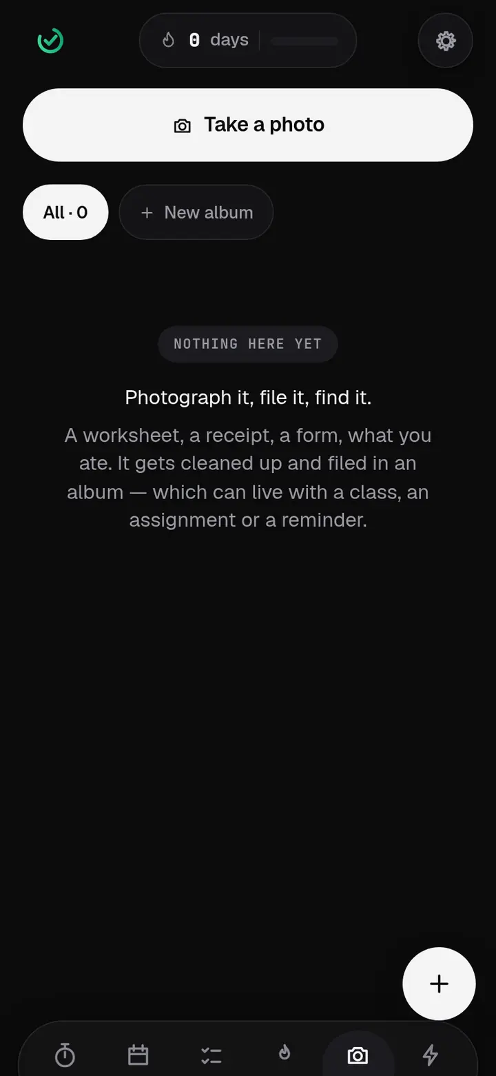 The Photos screen with a Take a photo button and an empty album, explaining that worksheets can be filed under a class.